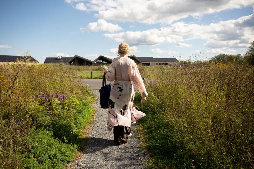 a bride on her way to get ready at her Wild Flower Farms wedding in Gardiner NY