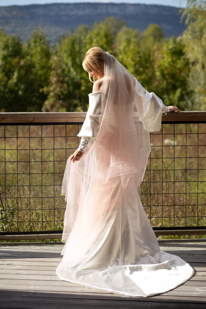 quiet bridal portrait on the deck of a cabin at Wild Flower Farms in Gardiner NY