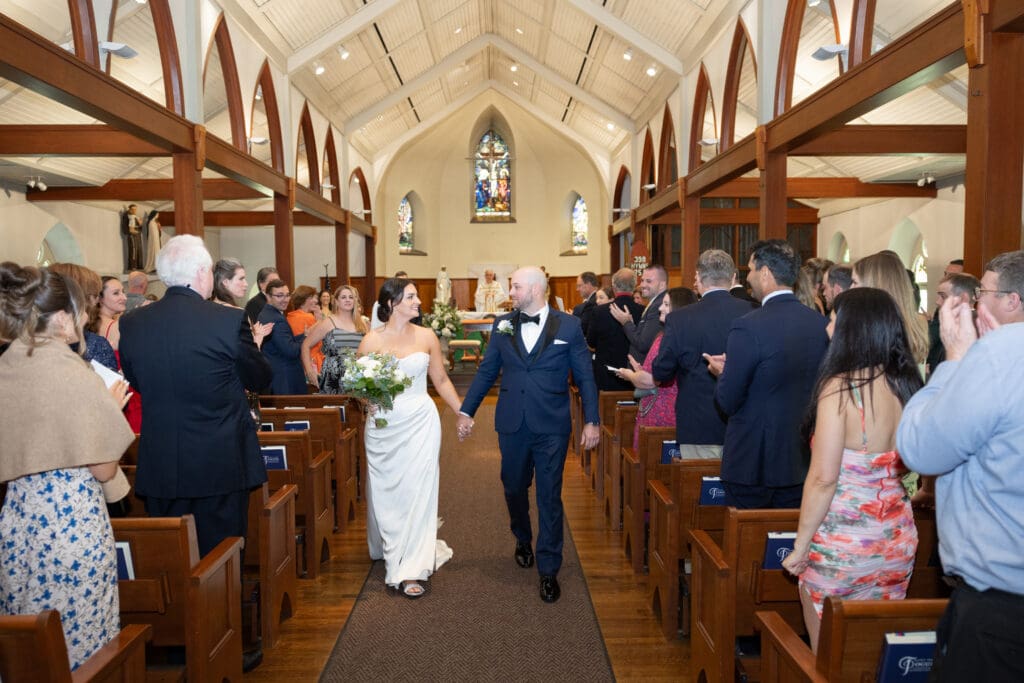 bride & groom walk down aisle at St John Darien wedding