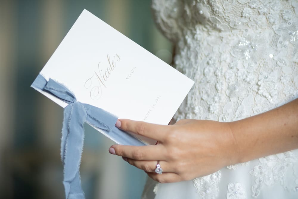 close up of a bride holding her wedding vows at crabtree's kittle house in chappaqua ny