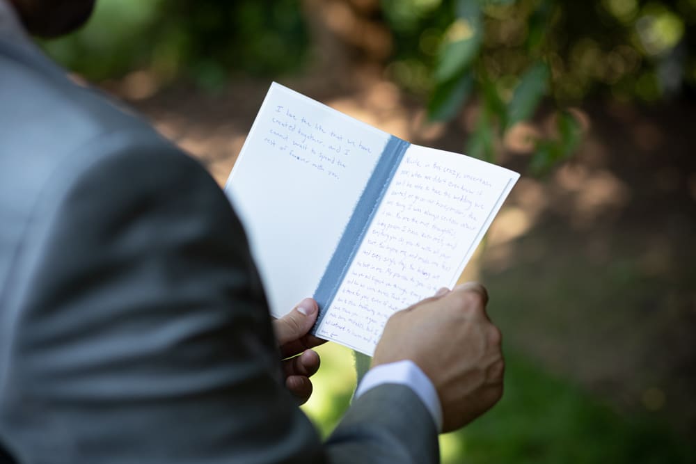 groom holding his wedding vows at crabtree's kittle house in chappaqua ny