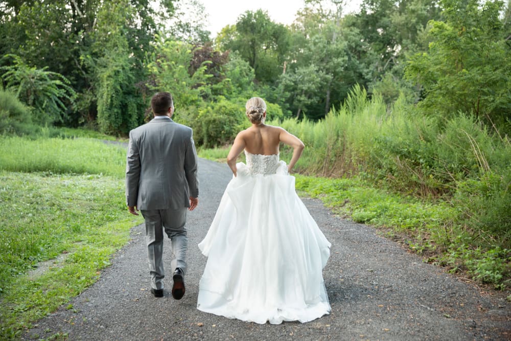 a bride and groom photographed from behind at crabtree's kittle house in chappaqua ny