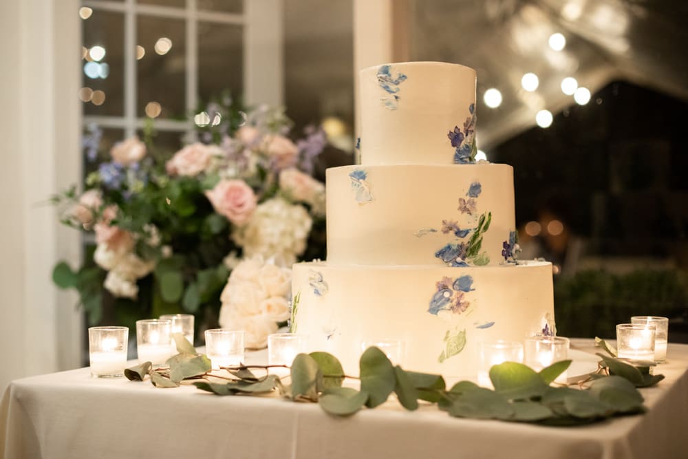 wedding cake lit by candles at crabtree's kittle house in chappaqua ny